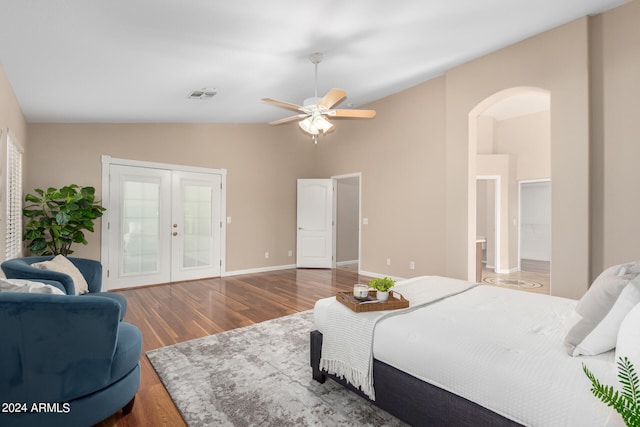 bedroom featuring ceiling fan, french doors, lofted ceiling, and hardwood / wood-style flooring