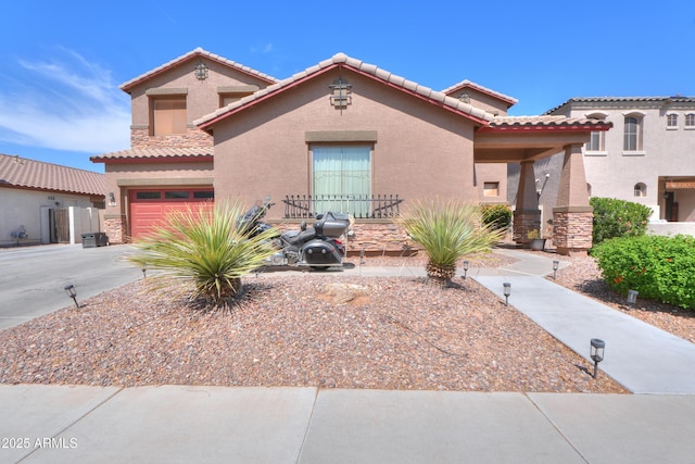 2115 N Cougar Ct, Casa Grande, AZ 85122 - mediterranean / spanish home featuring a tiled roof, stone siding, and stucco siding