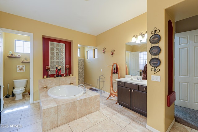 2115 N Cougar Ct, Casa Grande, AZ 85122 - full bathroom with tile patterned flooring, vanity, a garden tub, and toilet