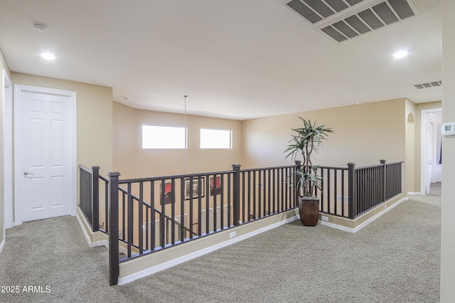 2115 N Cougar Ct, Casa Grande, AZ 85122 - corridor with carpet flooring, an upstairs landing, and visible vents