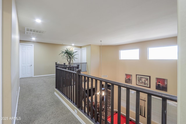 2115 N Cougar Ct, Casa Grande, AZ 85122 - hallway featuring baseboards, recessed lighting, an upstairs landing, carpet floors, and visible vents