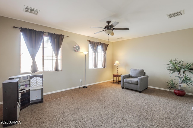 2115 N Cougar Ct, Casa Grande, AZ 85122 - living area with visible vents, a ceiling fan, and carpet