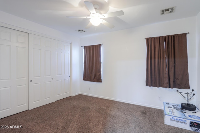 2115 N Cougar Ct, Casa Grande, AZ 85122 - unfurnished bedroom with a closet, dark colored carpet, and visible vents