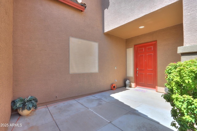 2115 N Cougar Ct, Casa Grande, AZ 85122 - property entrance with a patio area and stucco siding