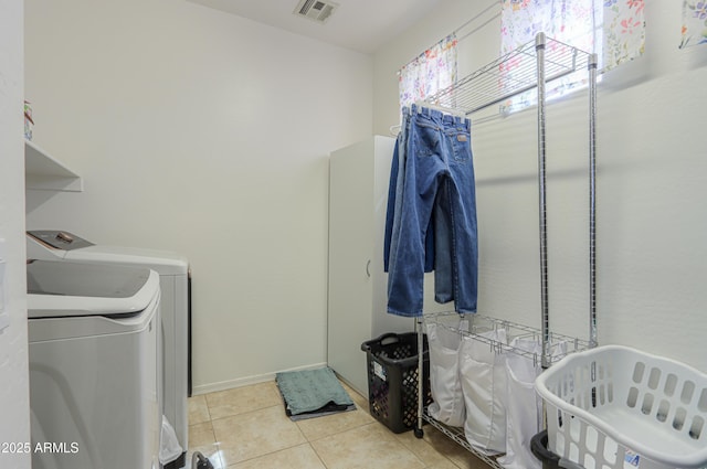 2115 N Cougar Ct, Casa Grande, AZ 85122 - laundry room with visible vents, baseboards, laundry area, washing machine and clothes dryer, and tile patterned flooring