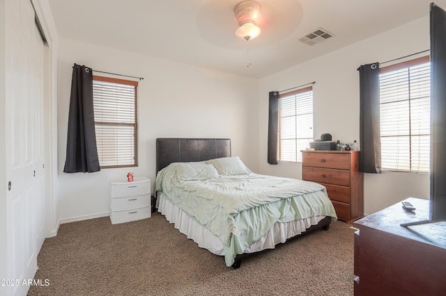 2115 N Cougar Ct, Casa Grande, AZ 85122 - bedroom with baseboards, a closet, carpet flooring, a ceiling fan, and visible vents