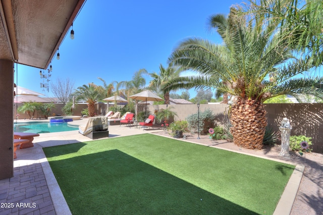 2115 N Cougar Ct, Casa Grande, AZ 85122 - view of yard with a fenced in pool, a patio area, and a fenced backyard