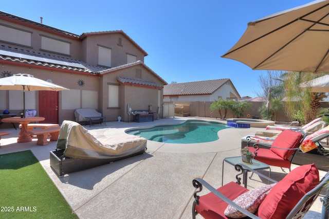 2115 N Cougar Ct, Casa Grande, AZ 85122 - view of swimming pool featuring a patio, a fenced backyard, and a pool with connected hot tub