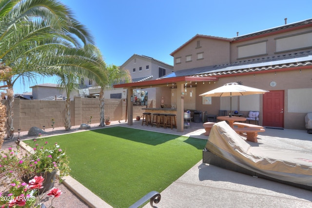 2115 N Cougar Ct, Casa Grande, AZ 85122 - view of yard featuring a patio, outdoor dry bar, and fence
