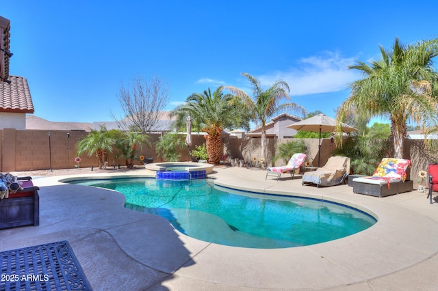 2115 N Cougar Ct, Casa Grande, AZ 85122 - view of swimming pool with a patio area, a fenced backyard, and a pool with connected hot tub