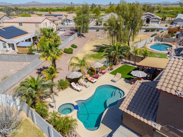 2115 N Cougar Ct, Casa Grande, AZ 85122 - community pool with a residential view, a patio, a fenced backyard, and a community hot tub