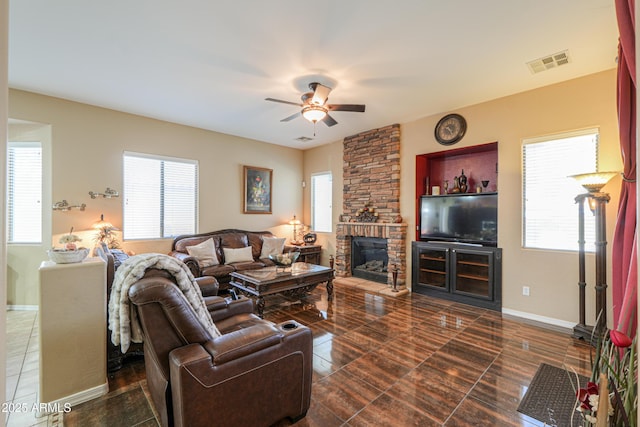 2115 N Cougar Ct, Casa Grande, AZ 85122 - living room with plenty of natural light, visible vents, a large fireplace, and ceiling fan