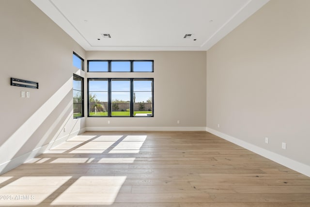 spare room featuring light wood-type flooring