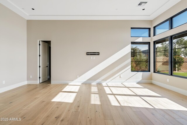 spare room with light hardwood / wood-style floors