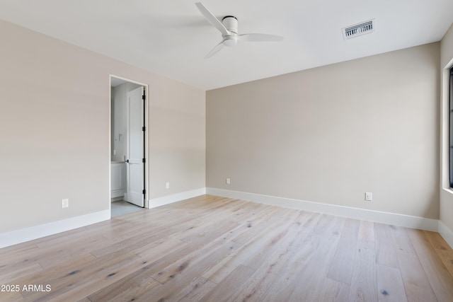 spare room featuring light hardwood / wood-style floors and ceiling fan