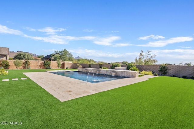 view of pool featuring a yard, pool water feature, and a patio