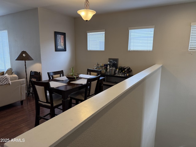 dining room with dark hardwood / wood-style flooring