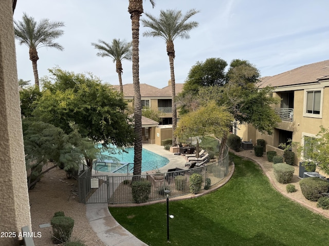 view of pool featuring central AC, area for grilling, a patio area, and a lawn