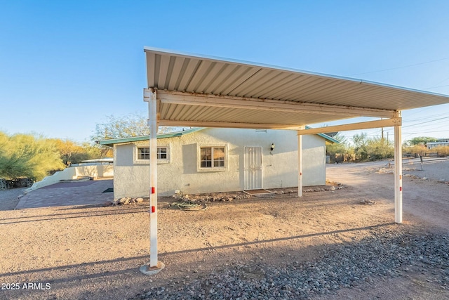 exterior space featuring a carport