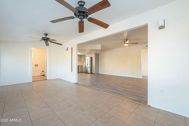 empty room with light tile patterned flooring