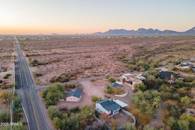 birds eye view of property with a mountain view