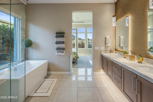 12311 E Black Rock Rd, Scottsdale, AZ 85255 - full bath featuring baseboards, double vanity, a bath, and healthy amount of natural light