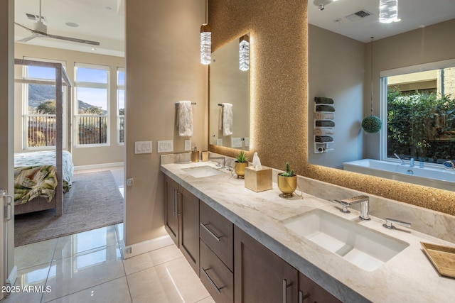 12311 E Black Rock Rd, Scottsdale, AZ 85255 - ensuite bathroom with double vanity, a bath, tile patterned flooring, and plenty of natural light