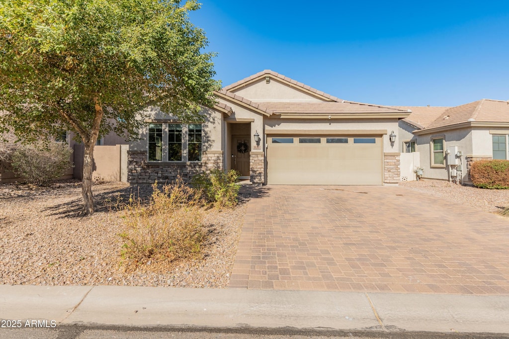 view of front of property featuring a garage