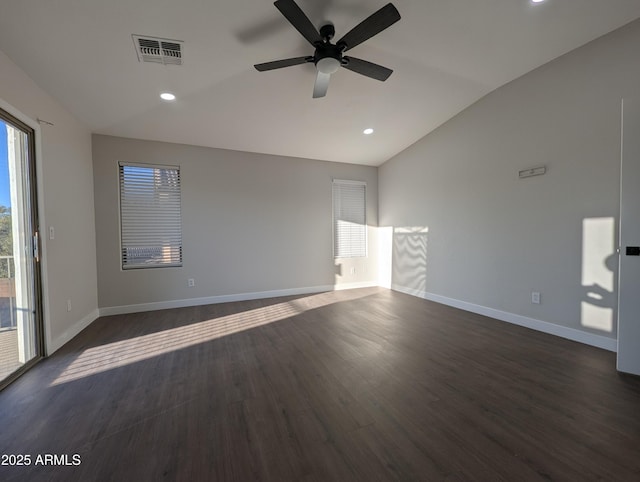 spare room with ceiling fan, lofted ceiling, and dark hardwood / wood-style flooring