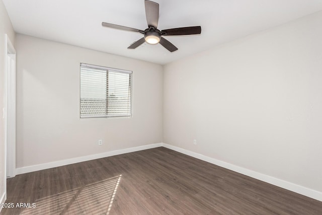 empty room featuring dark wood-type flooring and ceiling fan