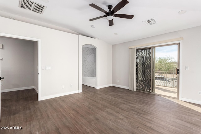 empty room with dark hardwood / wood-style flooring and ceiling fan