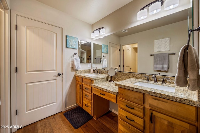 2540 W Waters Edge Ln, Lakeside, AZ 85929 - full bathroom featuring wood finished floors and double vanity