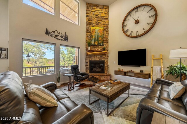 2540 W Waters Edge Ln, Lakeside, AZ 85929 - living room featuring a high ceiling, wood finished floors, and a fireplace