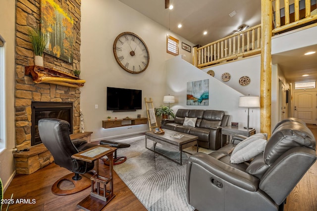 2540 W Waters Edge Ln, Lakeside, AZ 85929 - living area featuring wood finished floors, a stone fireplace, recessed lighting, and a high ceiling
