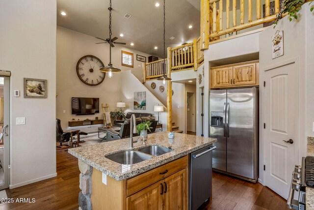 2540 W Waters Edge Ln, Lakeside, AZ 85929 - kitchen featuring appliances with stainless steel finishes, a high ceiling, dark wood finished floors, a ceiling fan, and an island with sink