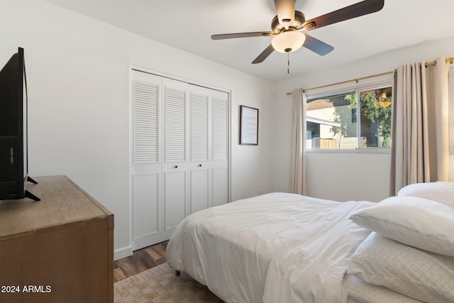 bedroom with ceiling fan, a closet, and hardwood / wood-style flooring