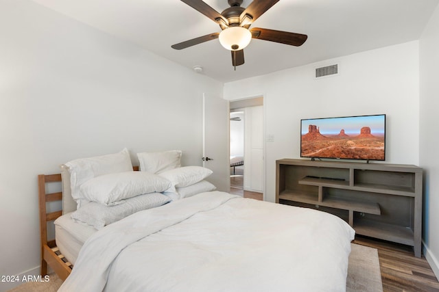 bedroom featuring ceiling fan and hardwood / wood-style flooring