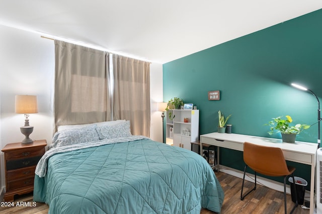 bedroom featuring hardwood / wood-style floors