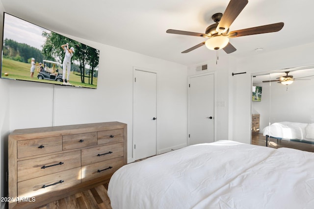 bedroom featuring hardwood / wood-style flooring and ceiling fan