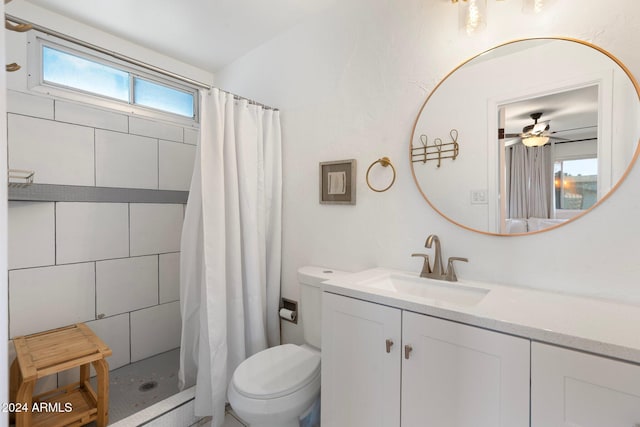 bathroom with a shower with shower curtain, vanity, plenty of natural light, and ceiling fan