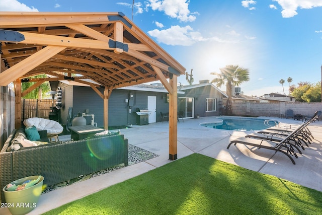 view of swimming pool featuring outdoor lounge area, a gazebo, a yard, area for grilling, and a patio