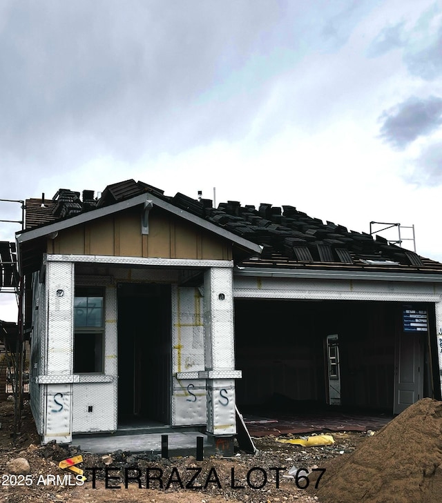 5664 N 205th Ln, Buckeye, AZ 85396 - view of front of home featuring board and batten siding