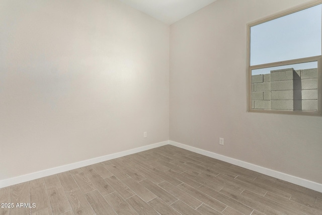 5664 N 205th Ln, Buckeye, AZ 85396 - empty room with light wood finished floors and baseboards