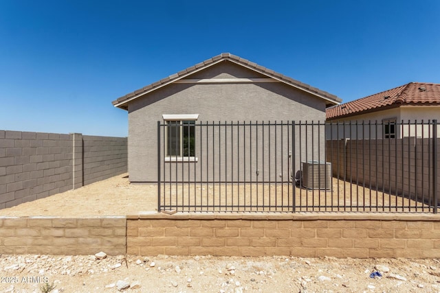 5664 N 205th Ln, Buckeye, AZ 85396 - view of property exterior with a fenced backyard, stucco siding, and a tile roof