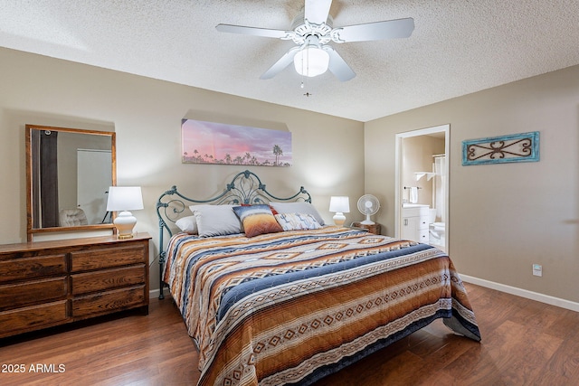 bedroom with ceiling fan, dark hardwood / wood-style floors, connected bathroom, and a textured ceiling