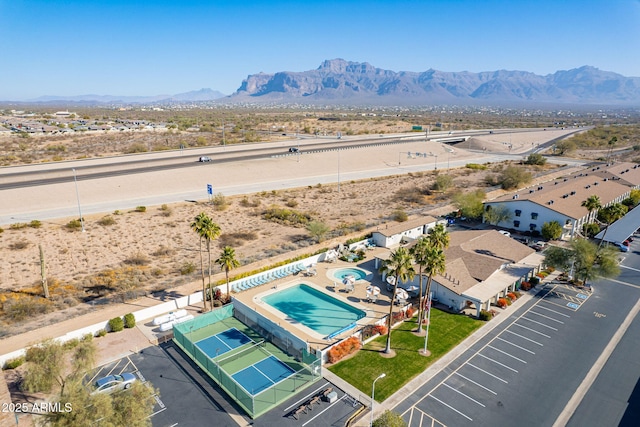 birds eye view of property with a mountain view