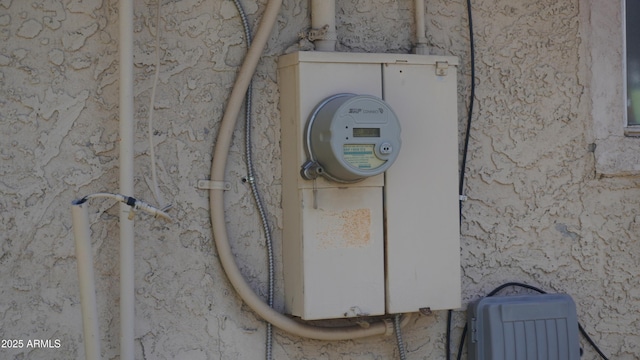 details with stucco siding and electric meter