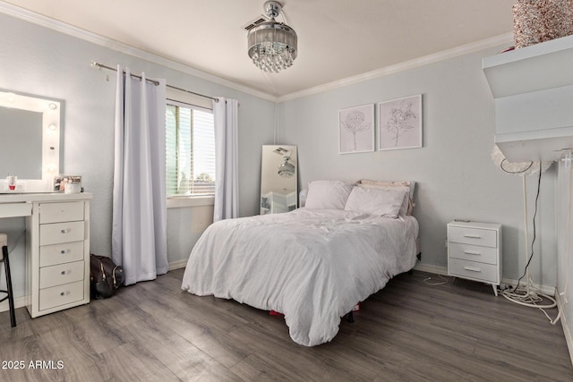 bedroom featuring ornamental molding, dark wood finished floors, and baseboards