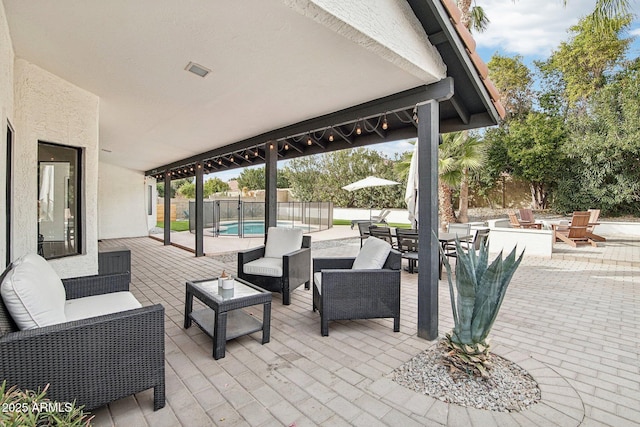 view of patio / terrace featuring outdoor dining area, outdoor lounge area, and a fenced in pool