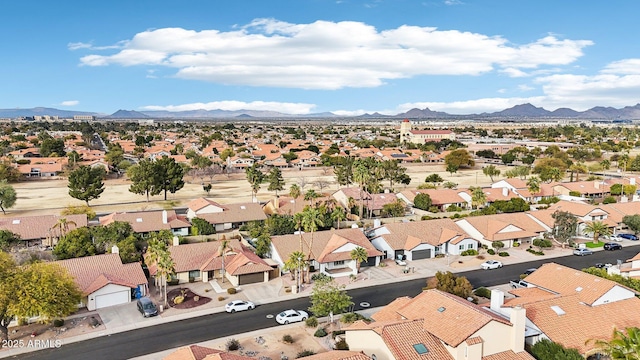 drone / aerial view featuring a residential view and a mountain view